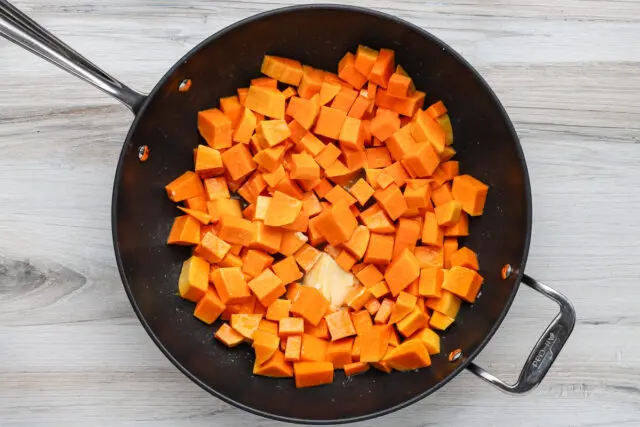 Butternut squash cubes are butter-poached with unsalted butter and water until softened.