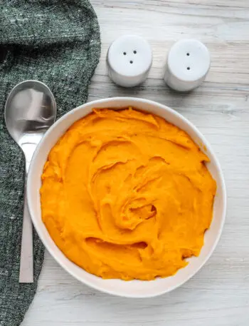 A serving bowl with mashed butternut squash.