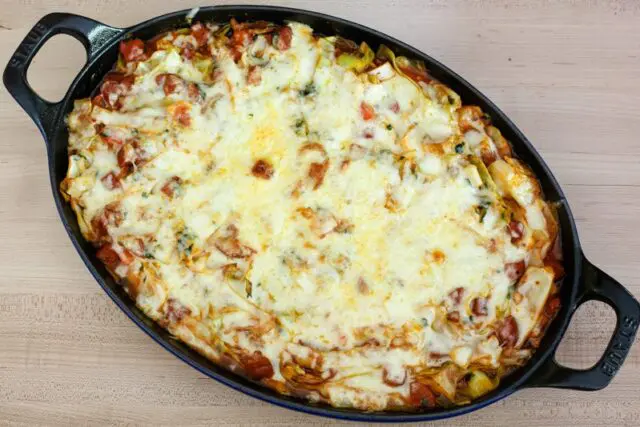 cabbage casserole with sausage in a staub baking dish