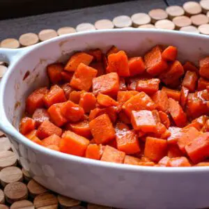 candied sweet potatoes with bourbon in a baking dish