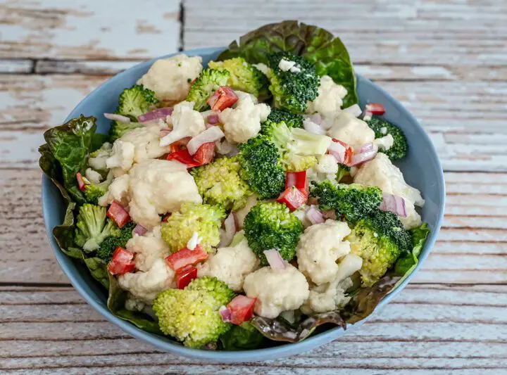 cauliflower and broccoli salad in a serving bowl