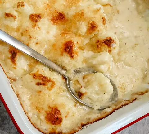 British cauliflower cheese in a baking dish.