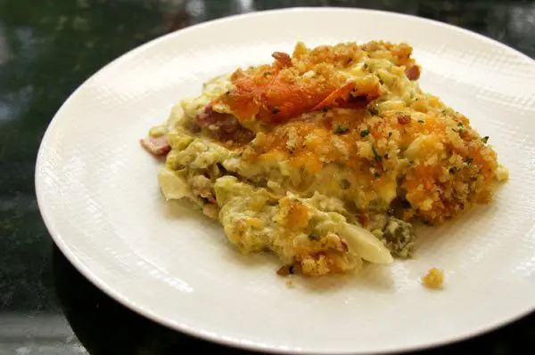 cabbage casserole with bacon and cheddar cheese on a plate