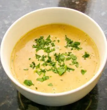 beer cheese soup with a variety of vegetables and cheddar cheese