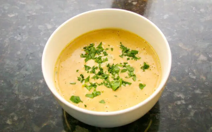 beer cheese soup with a variety of vegetables and cheddar cheese