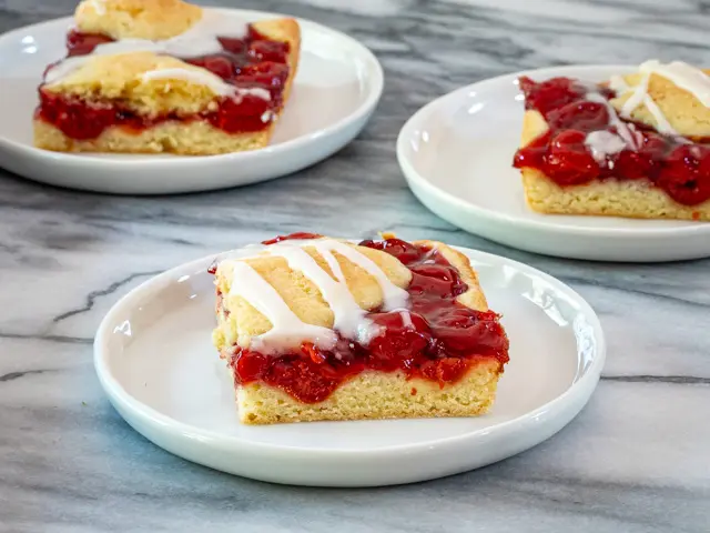 cherry cobbler bars on plates