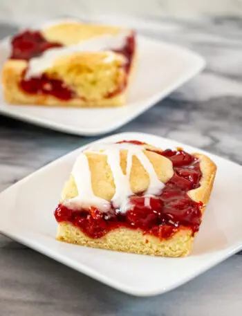 cherry cobbler bars with vanilla icing