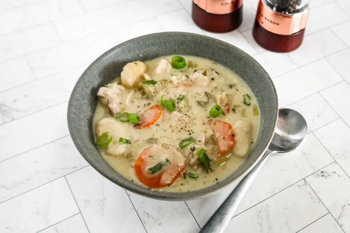 Chicken and dumpling soup with gnocchi dumplings, vegetables, and a creamy chicken broth.