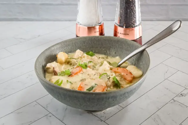 Chicken and dumpling soup with gnocchi dumplings, vegetables, and a creamy chicken broth.