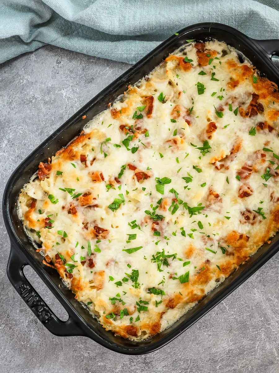 Chicken bacon ranch casserole freshly baked with a cheese and bacon topping.