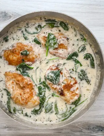 Creamy chicken florentine recipe in a skillet, ready to serve and enjoy.
