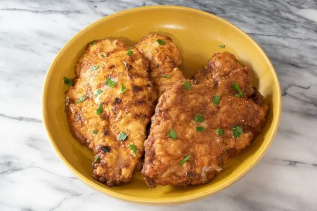 serving bowl with chicken francese