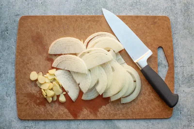 onions and garlic on a cutting board