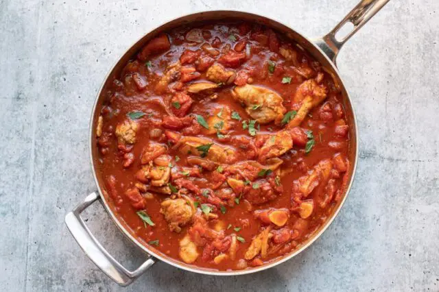 heating the chicken and tomato sauce mixture together