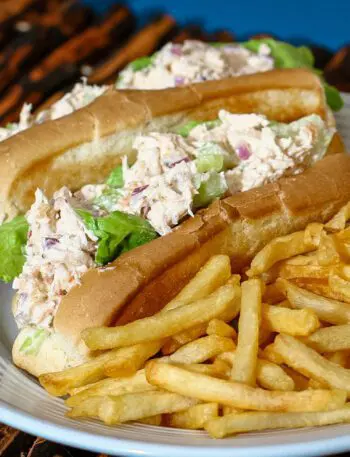 chicken salad sandwiches on buns with French fries on the side