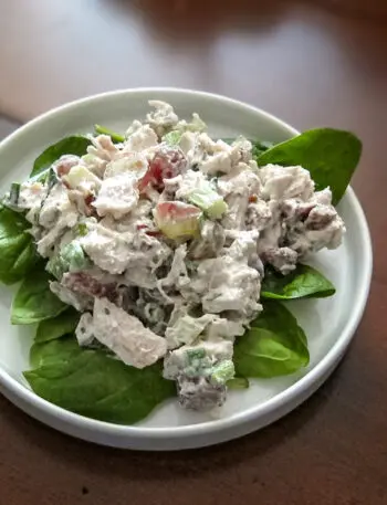 chicken salad with grapes on lettuce leaves