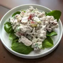 chicken salad with grapes on lettuce leaves