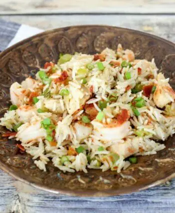 chicken rice pilaf with shrimp and bacon on a plate