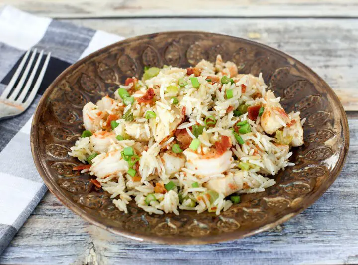 chicken rice pilaf with shrimp and bacon on a plate