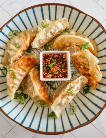 chili crisp dippping sauce with some fried dumplings