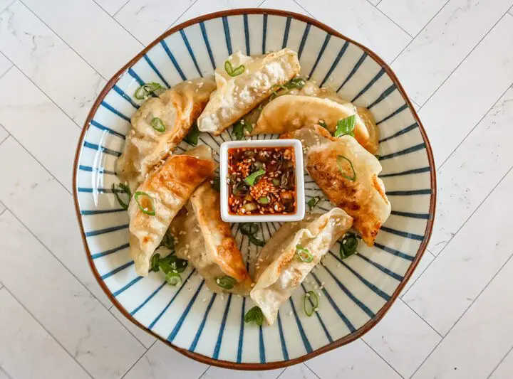 chili crisp dippping sauce with some fried dumplings