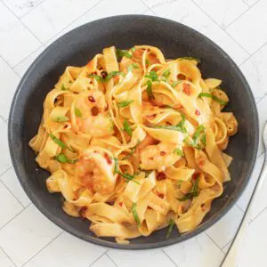 chili crisp shrimp fettuccine alfredo in a bowl