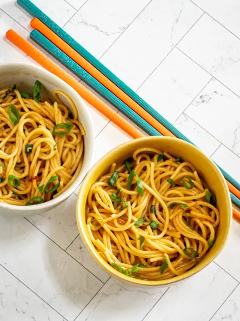 chili garlic noodles in small bowls