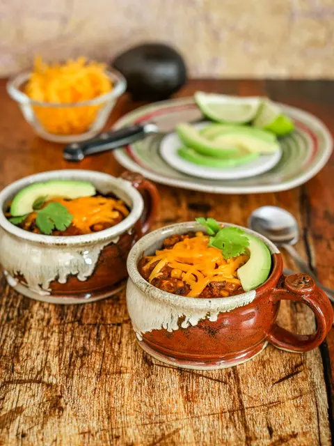 chili in cups with garnishes