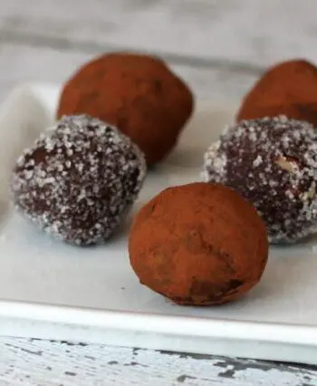 chocolate bourbon truffles on a plate with cocoa or sugar coating