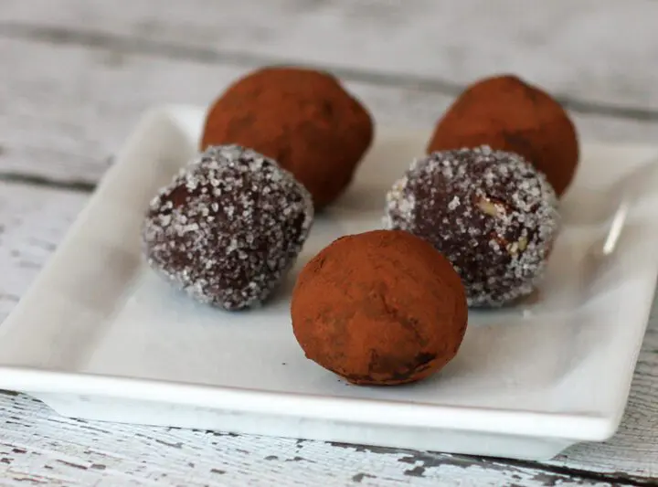 chocolate bourbon truffles on a plate with cocoa or sugar coating