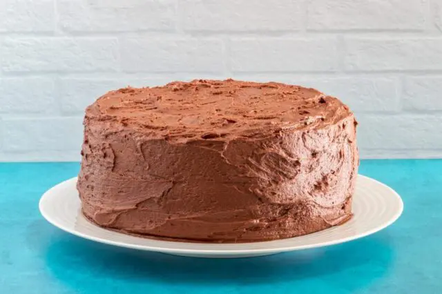 layer cake with chocolate buttercream frosting