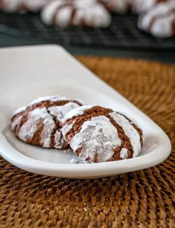 a small plate with chocolate crinkle cookies