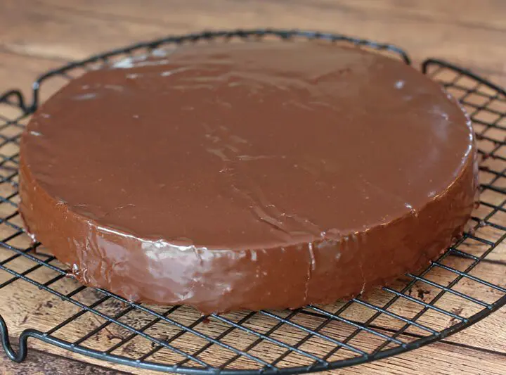 A cake layer covered with chocolate glaze