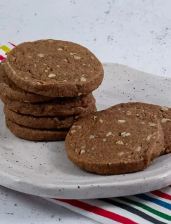 chocolate icebox cookies stacked on a plate