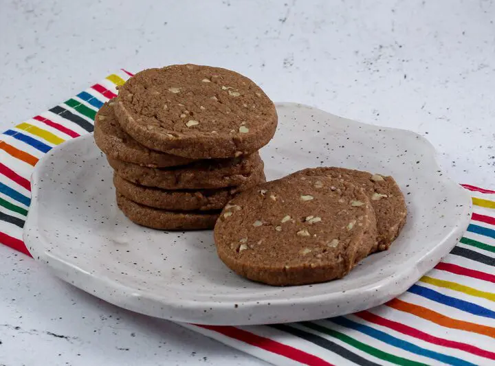 chocolate icebox cookies stacked on a plate