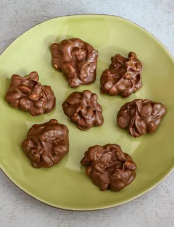 chocolate peanut clusters on a plate