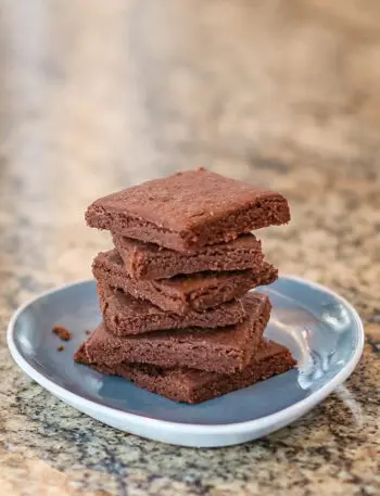 chocolate shortbread stacked on a small plate