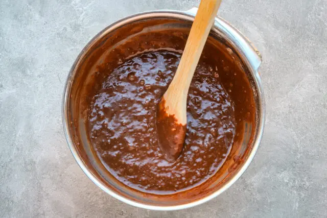 Chocolate zucchini muffin prep: Make the batter.