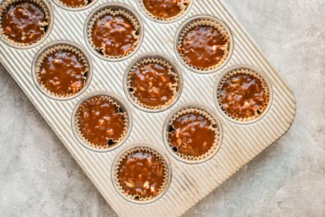 Chocolate zucchini muffins are ready to bake.