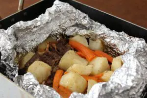 chuck steak and potatoes in foil baked