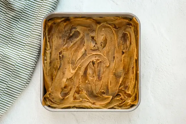 The second layer of batter and more swirls of cinnamon batter.