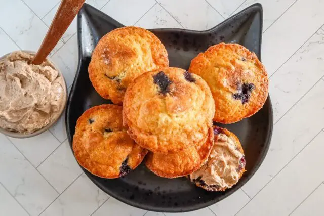 plate of moist blueberry muffins
