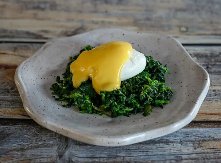 classic hollandaise sauce on a poached egg