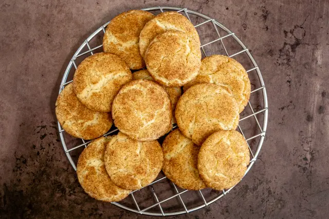 snickerdoodle cookies on a cooling rack