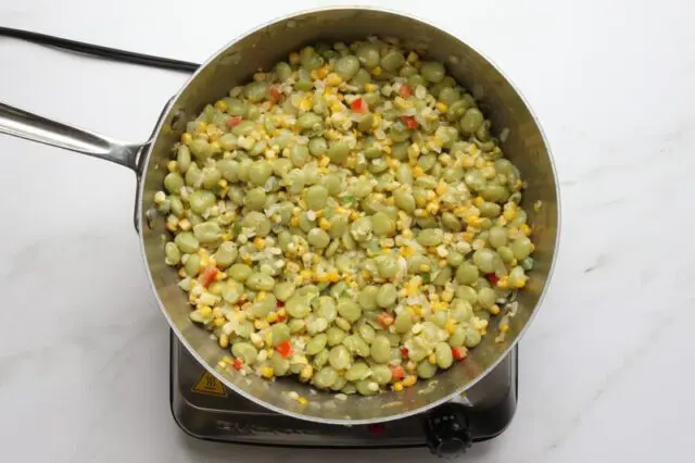 southern succotash cooking in a saucier pan