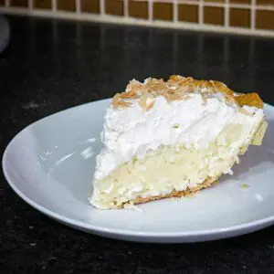 coconut cream pie on a dessert plate