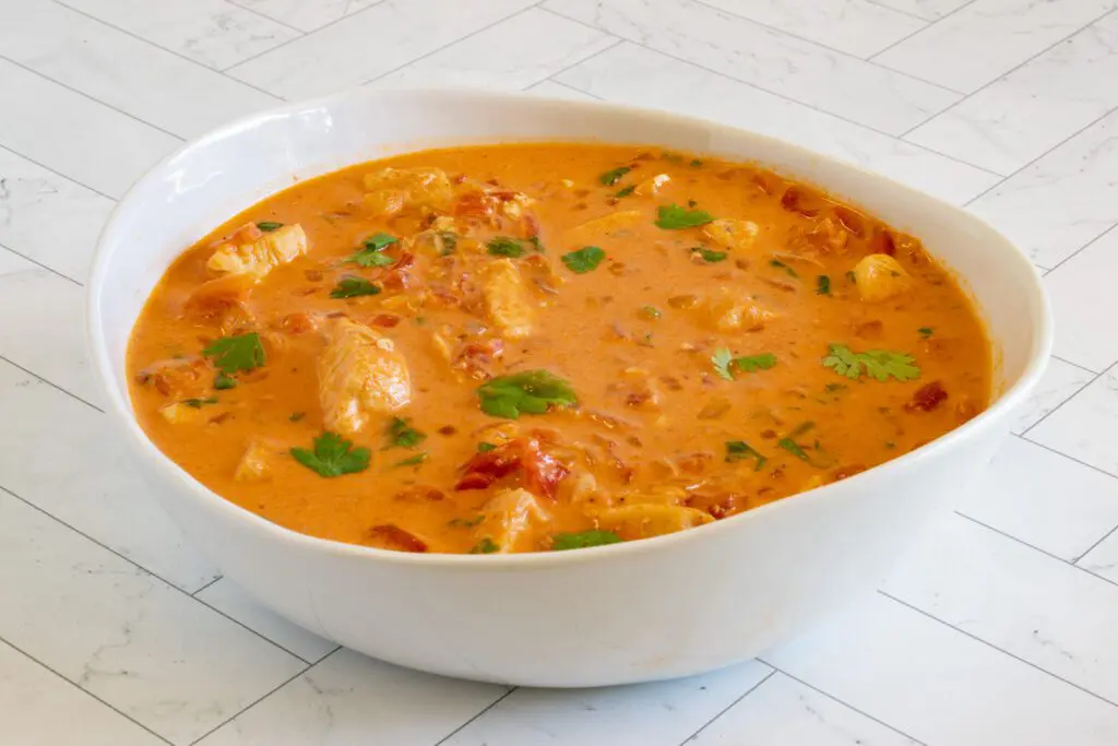 a bowl of coconut curry chicken