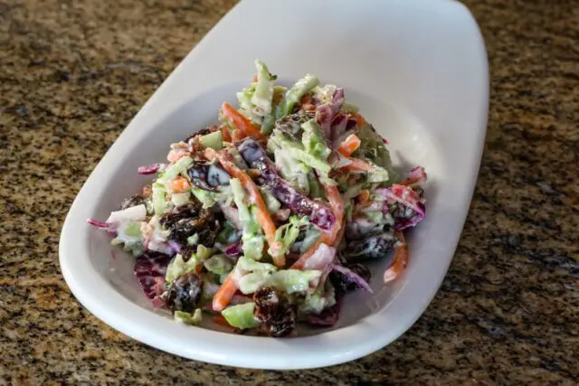 colorful coleslaw with mayonnaise and sour cream dressing