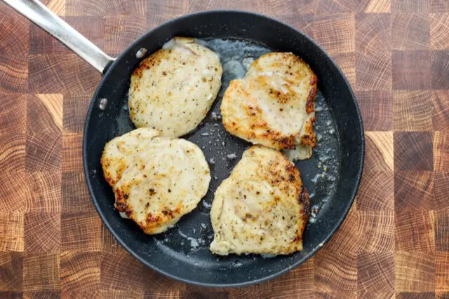 Browning the chicken breast cutlets for a company chicken recipe.