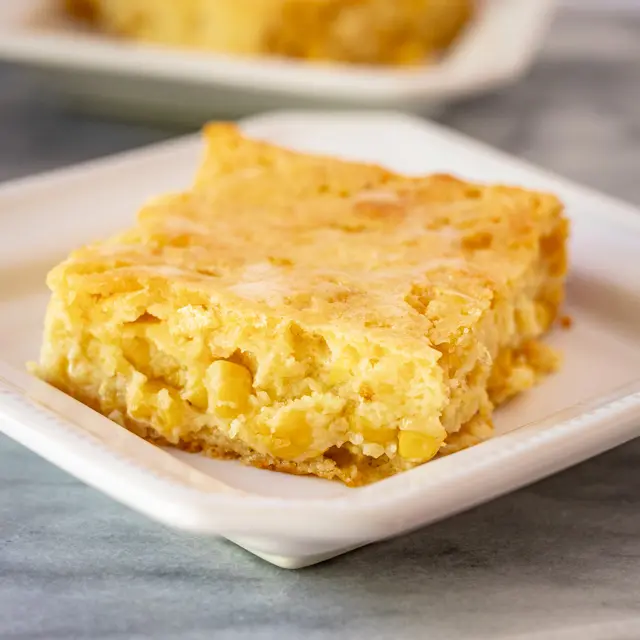 A serving of cornbread casserole on a plate